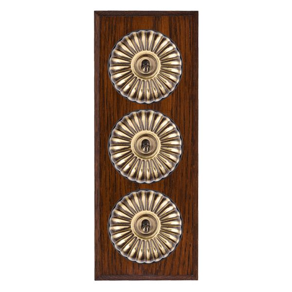 Bloomsbury Chamfered Antique Mahogany 3 gang 20AX 2 Way Toggle Antique Brass Fluted Dome/Black Collar