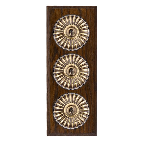 Bloomsbury Chamfered Dark Oak 3 gang 20AX 2 Way Toggle Antique Brass Fluted Dome/Black Collar