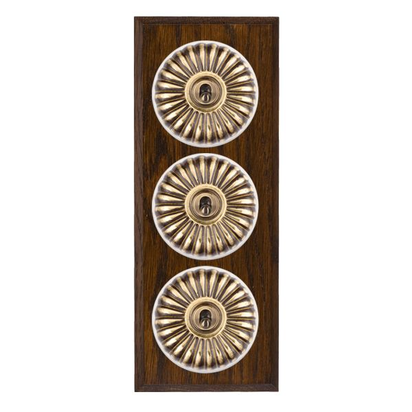 Bloomsbury Chamfered Dark Oak 3 gang 20AX 2 Way Toggle Antique Brass Fluted Dome/White Collar