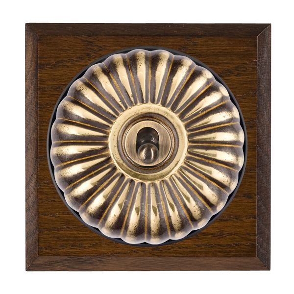 Bloomsbury Chamfered Dark Oak 1 gang 20AX Intermediate Toggle Antique Brass Fluted Dome/Black Collar