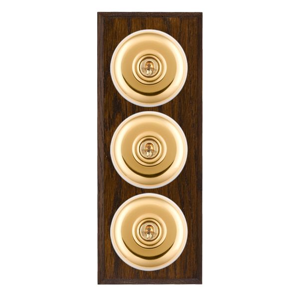 Bloomsbury Chamfered Dark Oak 3 gang 20AX 2 Way Toggle Polished Brass Plain Dome/White Collar