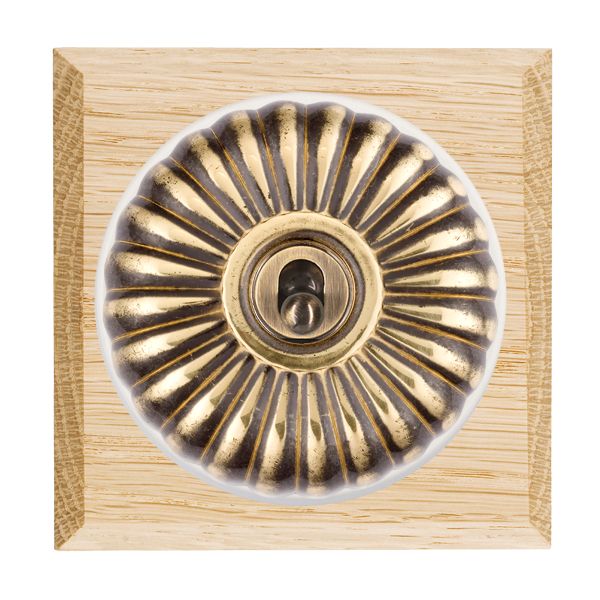 Bloomsbury Chamfered Light Oak 1 gang 20AX 2 Way Toggle Antique Brass Fluted Dome/White Collar
