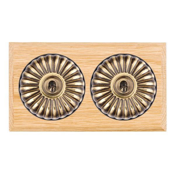 Bloomsbury Chamfered Light Oak 2 gang 20AX 2 Way Toggle Antique Brass Fluted Dome/Black Collar