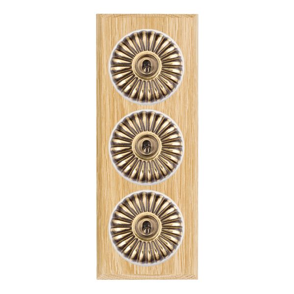 Bloomsbury Chamfered Light Oak 3 gang 20AX 2 Way Toggle Antique Brass Fluted Dome/White Collar