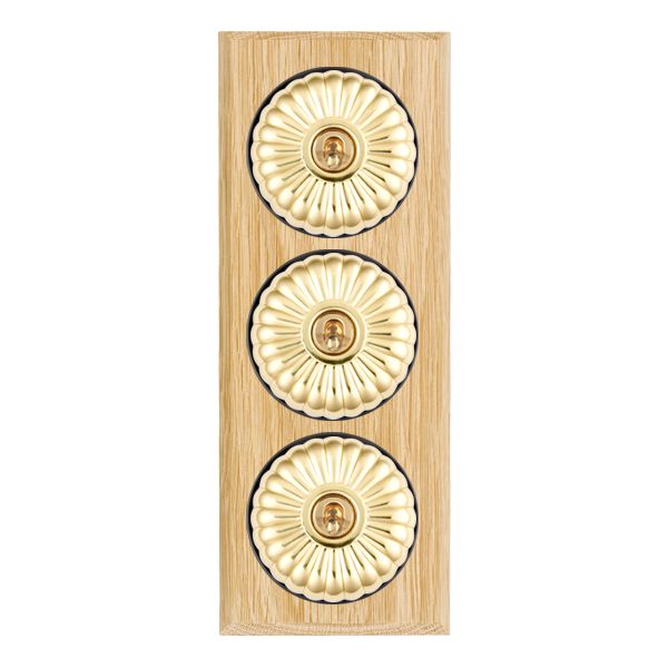 Bloomsbury Chamfered Light Oak 3 gang 20AX 2 Way Toggle Polished Brass Fluted Dome/Black Collar