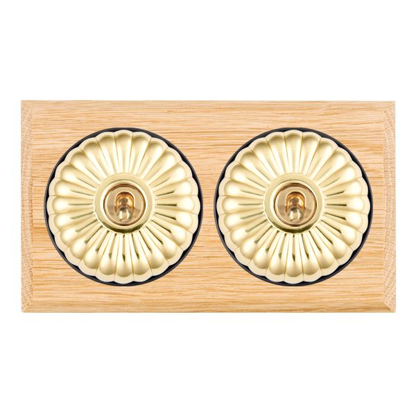 Bloomsbury Chamfered Light Oak 2 gang 20AX Intermediate Toggle Polished Brass Fluted Dome/Black Collar