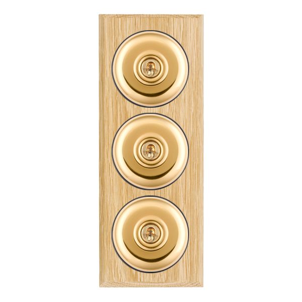 Bloomsbury Chamfered Light Oak 3 gang 20AX 2 Way Toggle Polished Brass Plain Dome/Black Collar