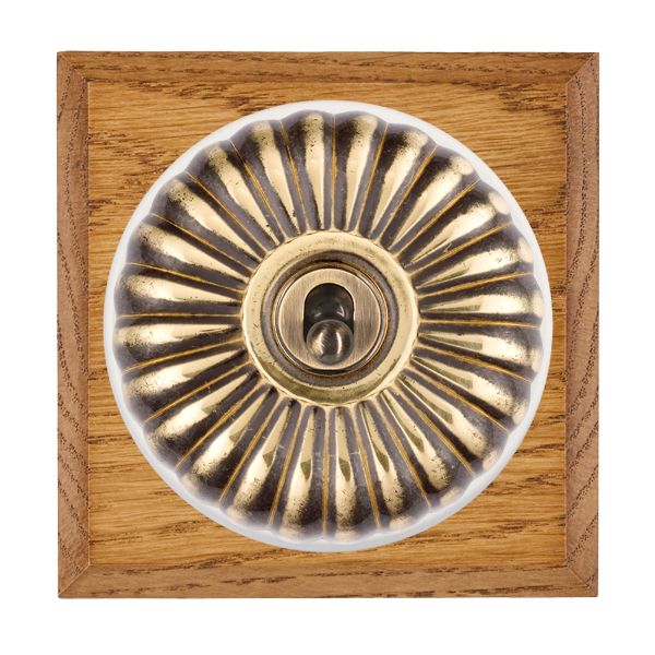 Bloomsbury Chamfered Medium Oak 1 gang 20AX 2 Way Toggle Antique Brass Fluted Dome/White Collar