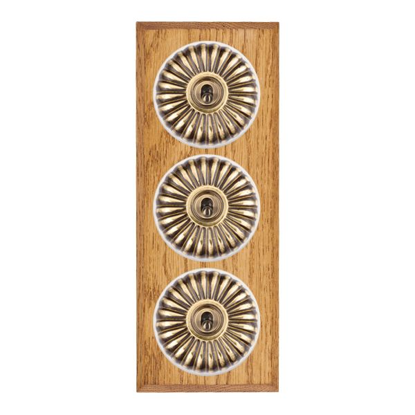 Bloomsbury Chamfered Medium Oak 3 gang 20AX 2 Way Toggle Antique Brass Fluted Dome/White Collar