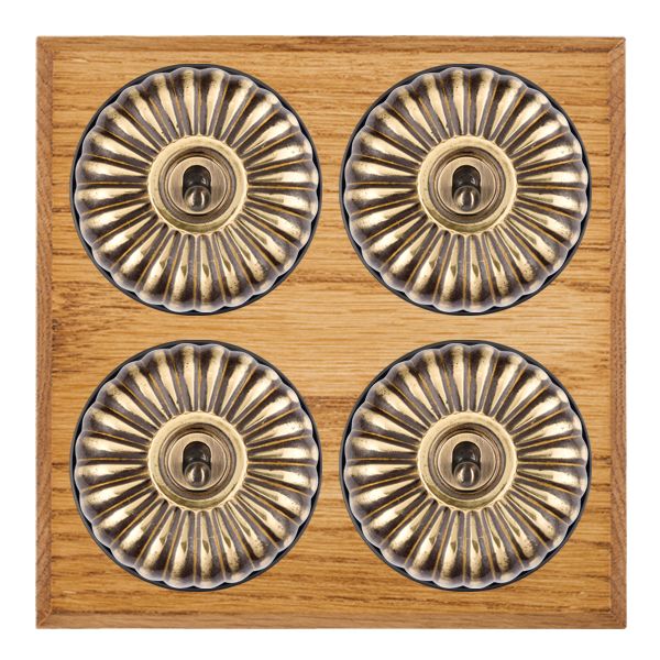Bloomsbury Chamfered Medium Oak 4 gang 20AX 2 Way Toggle Antique Brass Fluted Dome/Black Collar
