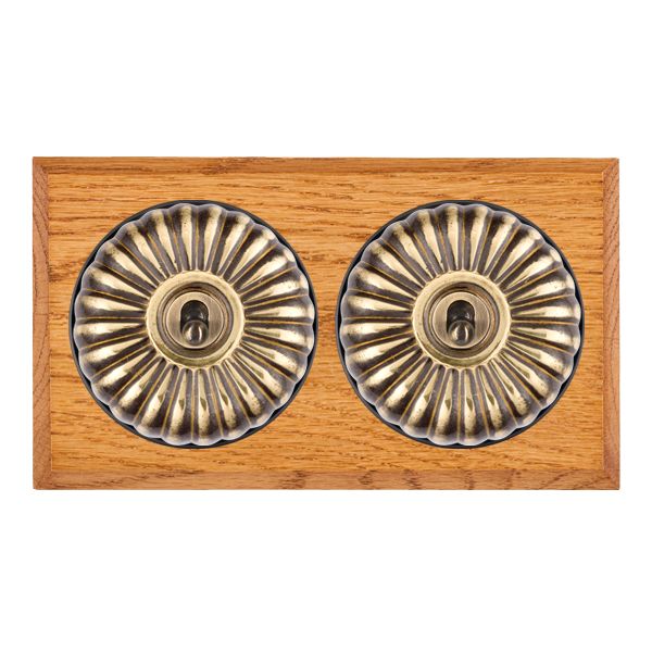 Bloomsbury Chamfered Medium Oak 2 gang 20AX Intermediate Toggle Antique Brass Fluted Dome/Black Collar