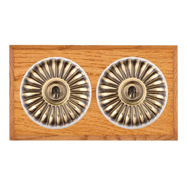 Bloomsbury Chamfered Medium Oak 2 gang 20AX Intermediate Toggle Antique Brass Fluted Dome/White Collar