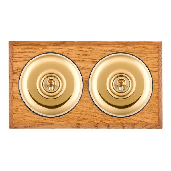 Bloomsbury Chamfered Medium Oak 2 gang 20AX 2 Way Toggle Polished Brass Plain Dome/Black Collar