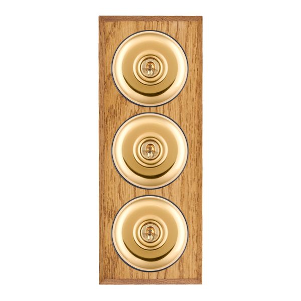 Bloomsbury Chamfered Medium Oak 3 gang 20AX 2 Way Toggle Polished Brass Plain Dome/Black Collar