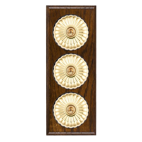 Bloomsbury Ovolo Dark Oak 3 gang 20AX 2 Way Toggle Polished Brass Fluted Dome/Black Collar