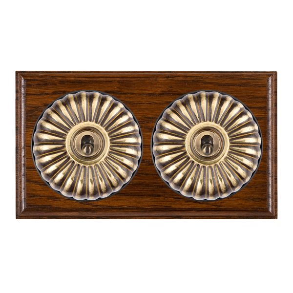 Bloomsbury Ovolo Dark Oak 2 gang 20AX Intermediate Toggle Antique Brass Fluted Dome/Black Collar