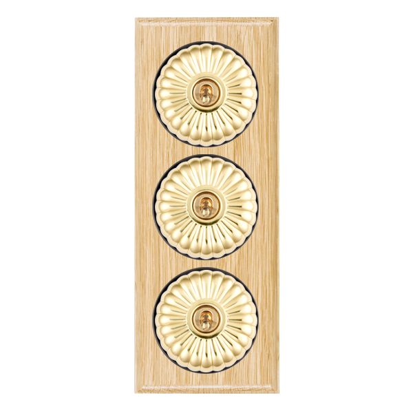 Bloomsbury Ovolo Light Oak 3 gang 20AX 2 Way Toggle Polished Brass Fluted Dome/Black Collar