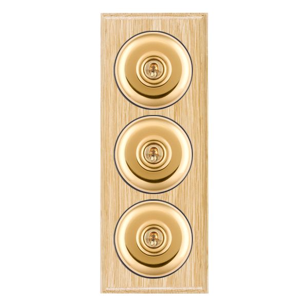 Bloomsbury Ovolo Light Oak 3 gang 20AX 2 Way Toggle Polished Brass Plain Dome/Black Collar