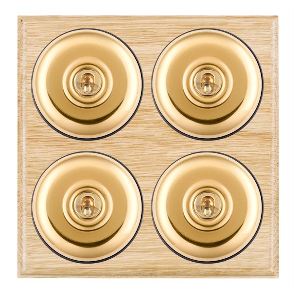 Bloomsbury Ovolo Light Oak 4 gang 20AX 2 Way Toggle Polished Brass Plain Dome/Black Collar