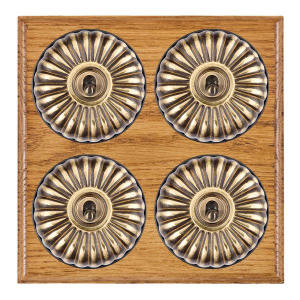 Bloomsbury Ovolo Medium Oak 4 gang 20AX 2 Way Toggle Antique Brass Fluted Dome/Black Collar