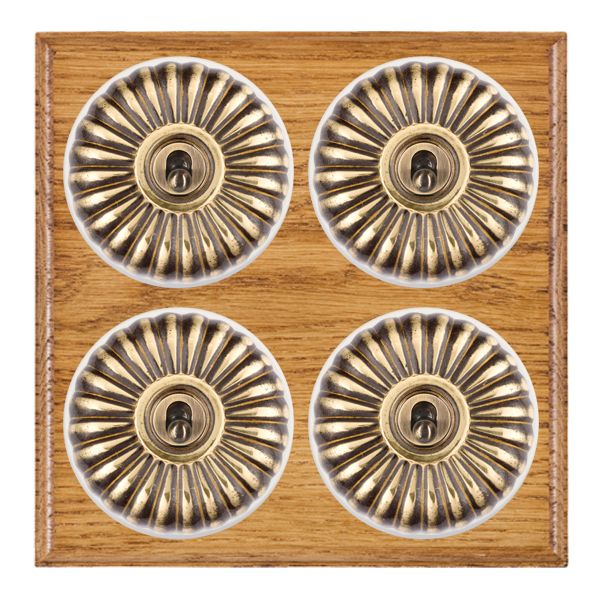Bloomsbury Ovolo Medium Oak 4 gang 20AX 2 Way Toggle Antique Brass Fluted Dome/White Collar