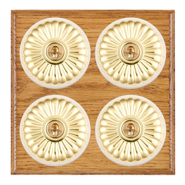 Bloomsbury Ovolo Medium Oak 4 gang 20AX 2 Way Toggle Polished Brass Fluted Dome/White Collar