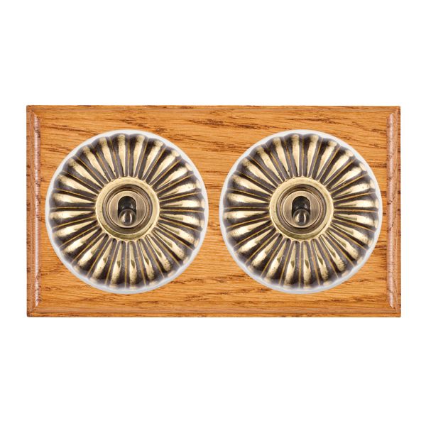 Bloomsbury Ovolo Medium Oak 2 gang 20AX Intermediate Toggle Antique Brass Fluted Dome/White Collar