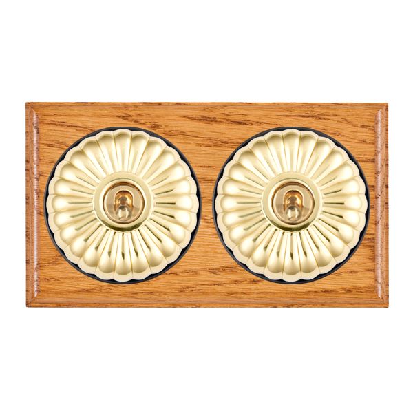 Bloomsbury Ovolo Medium Oak 2 gang 20AX Intermediate Toggle Polished Brass Fluted Dome/Black Collar