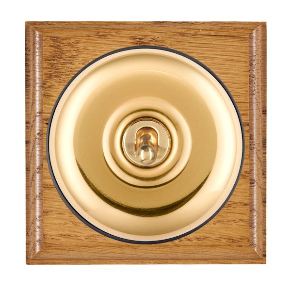 Bloomsbury Ovolo Medium Oak 1 gang 20AX 2 Way Toggle Polished Brass Plain Dome/Black Collar