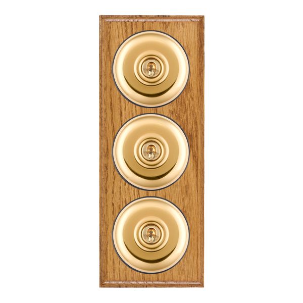 Bloomsbury Ovolo Medium Oak 3 gang 20AX 2 Way Toggle Polished Brass Plain Dome/Black Collar