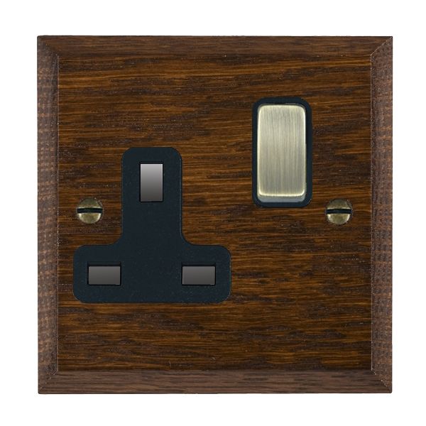 Woods Chamfered Dark Oak 1 gang 13A Double Pole Switched Socket Antique Brass/Black