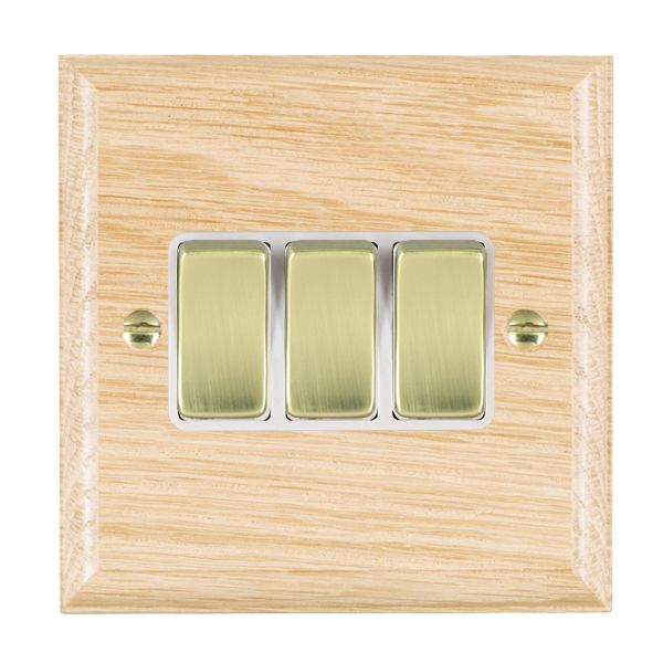 Woods Ovolo Light Oak 3 gang 10AX 2 Way Rocker Polished Brass/White